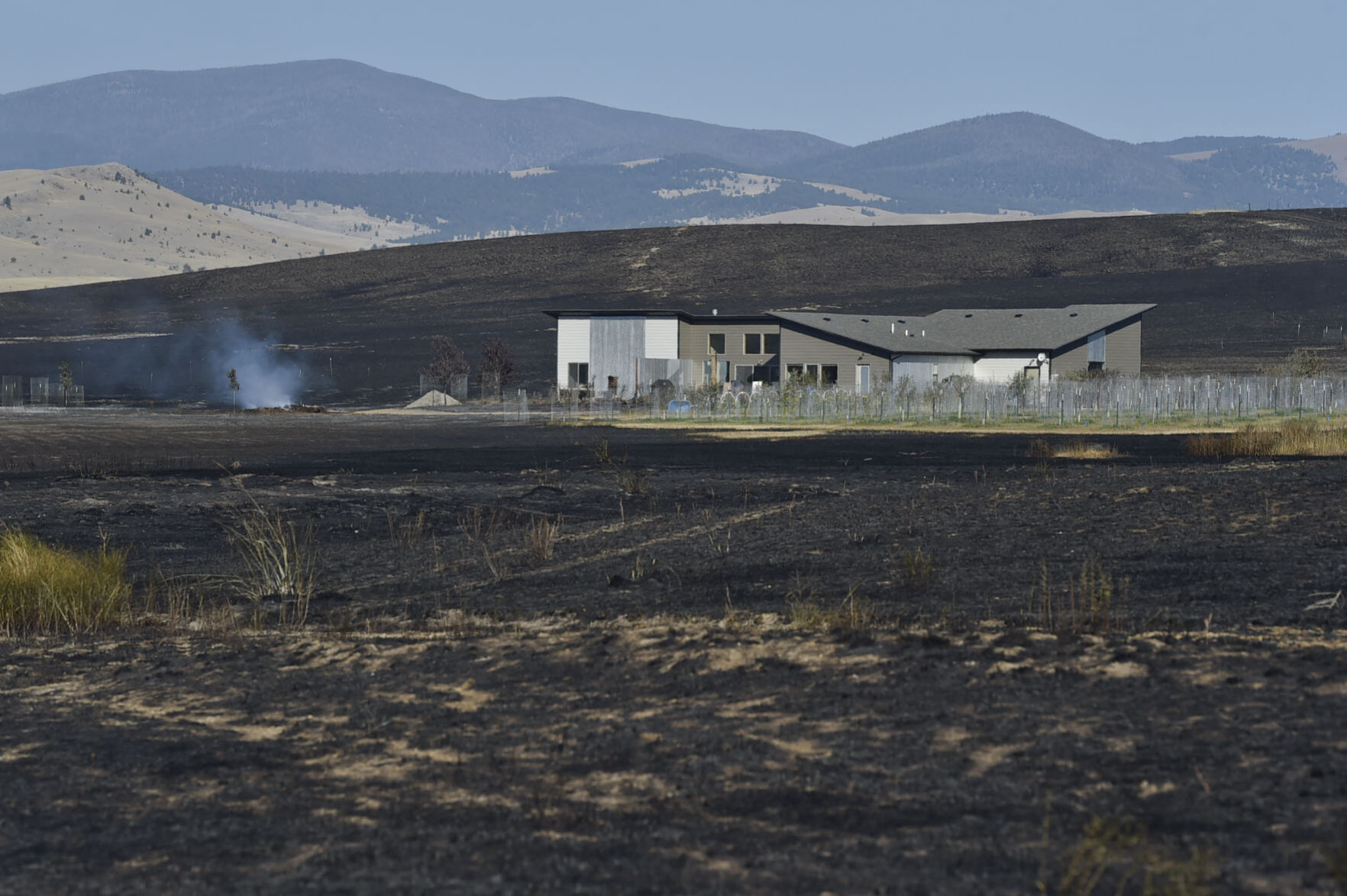 Burnt ground blankets the area